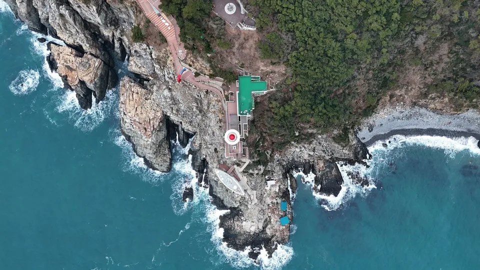 Rocky coastline and landmarks in Busan