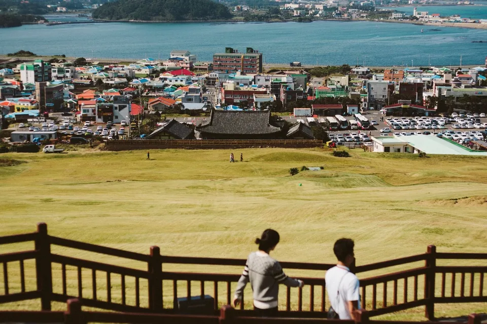Coastal town seen from the slopes of Seongsan on Jeju Island